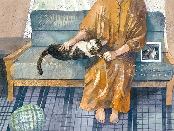 ソファで猫を撫でる人物のイラスト