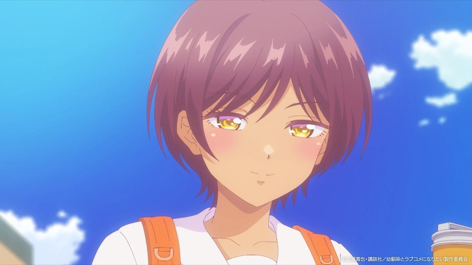 アニメの少女が微笑んでいるクローズアップ