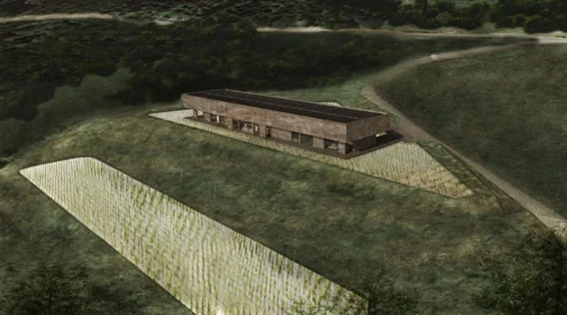 丘の上に建つモダンな宿泊施設の空撮