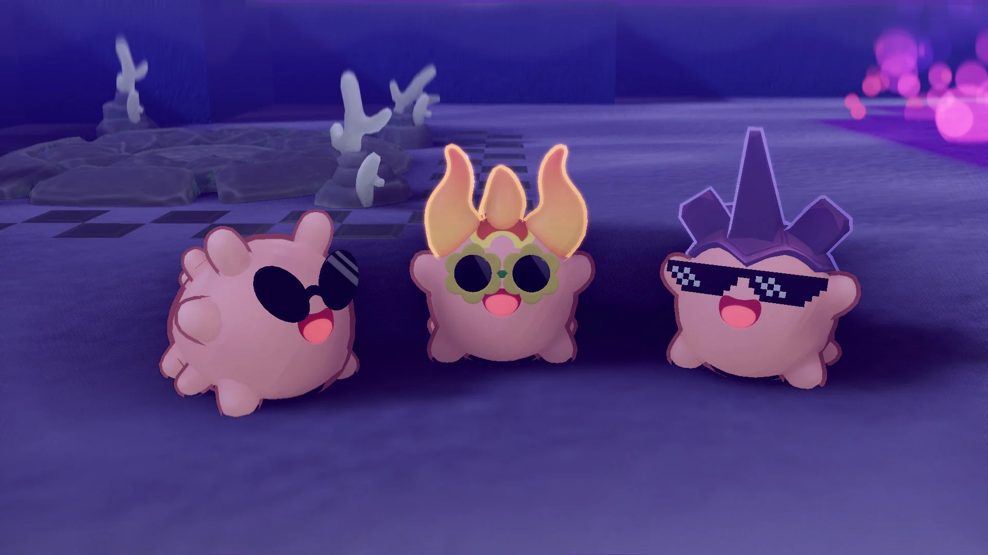 ピンク色の丸い3体のキャラクターが、それぞれ異なるサングラスをかけてポーズをとっています。暗い紫色の背景には、サンゴのようなオブジェクトや光の玉が見えます。