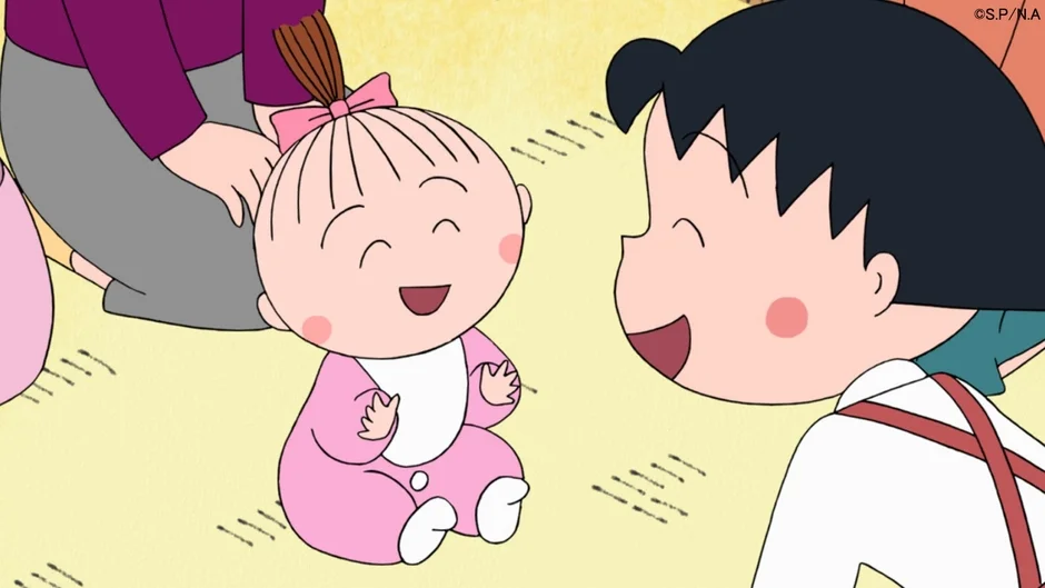 まる子と赤ちゃんが笑顔で向き合う