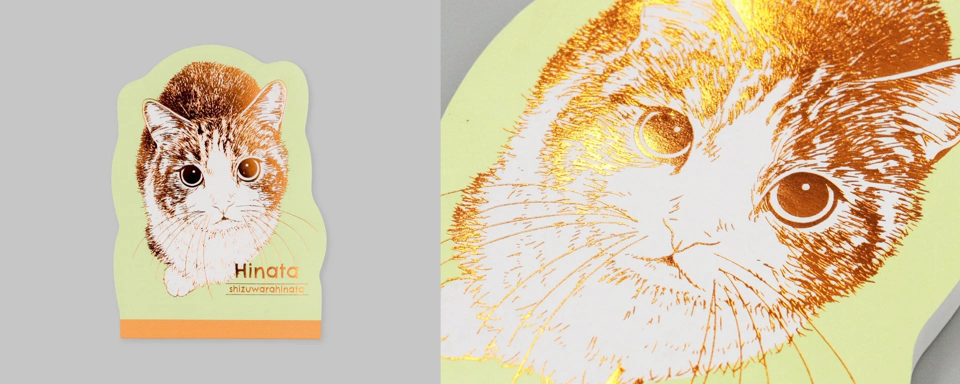 淡い緑色の背景に金色の箔押しの子猫の顔のイラスト