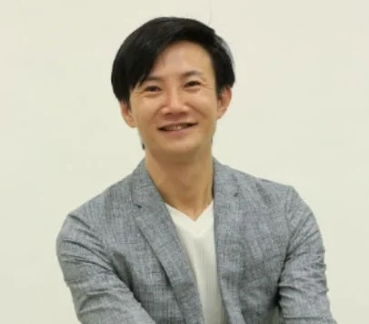 笑顔を見せる池田朋弘氏