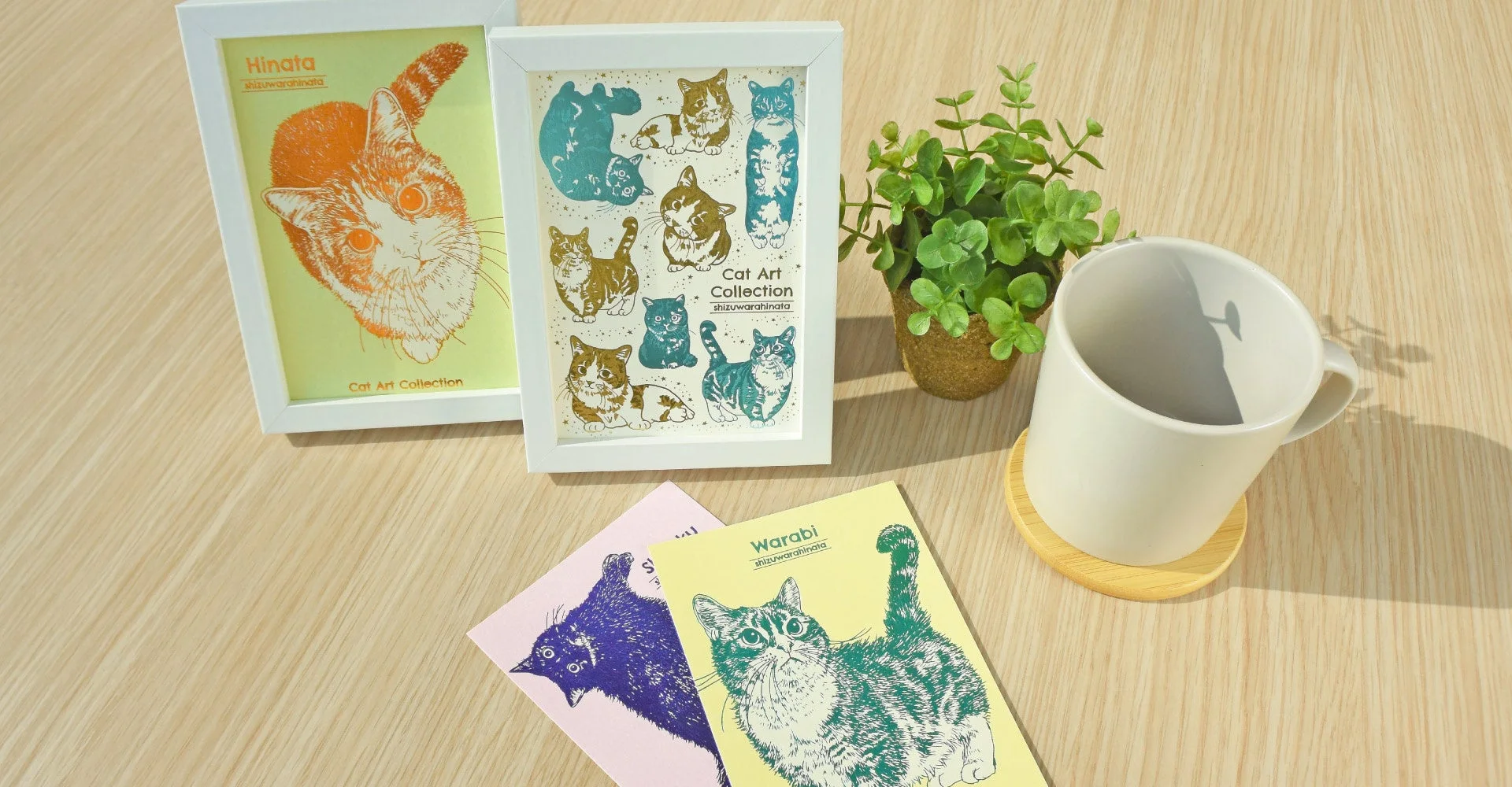 猫アート作品やグッズが並べられた写真