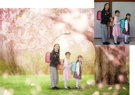 桜の木の下でランドセルを背負った子供たちの記念写真